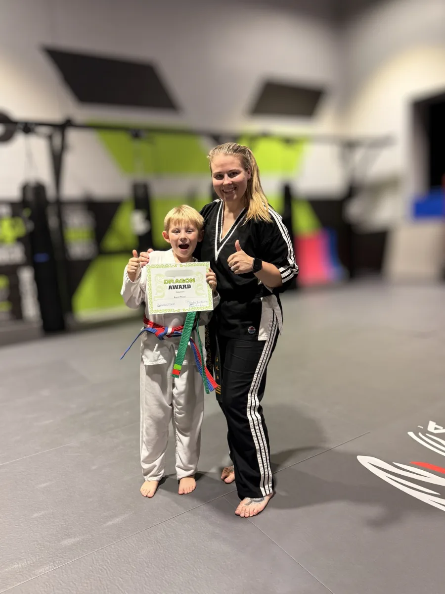 Student receiving a certificate at Rise Up NJ martial arts in Atco NJ
