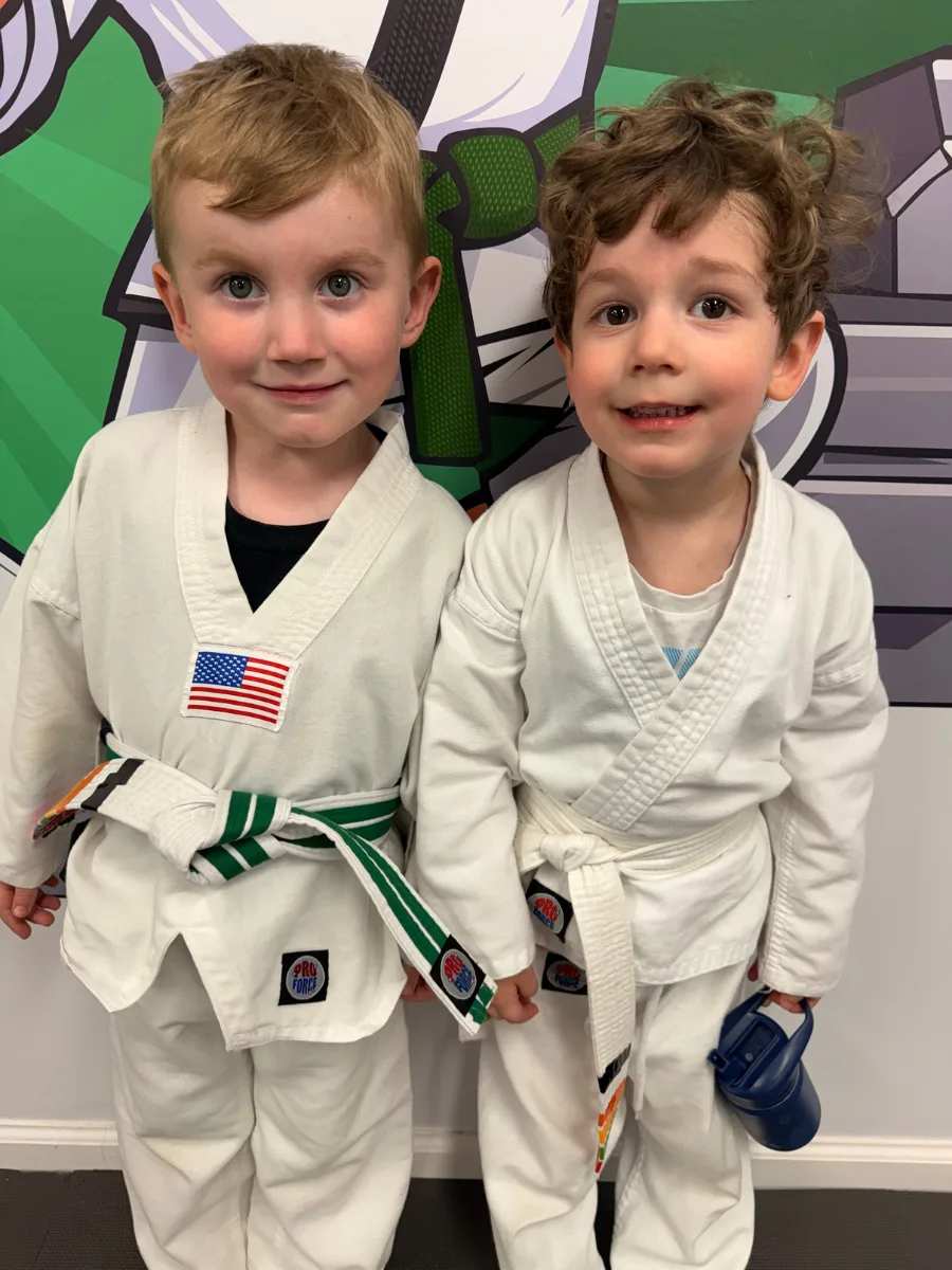 Two young martial arts students in uniform at Rise Up NJ in Atco, NJ